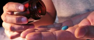 man takes a pill at night
