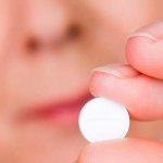 таблетка в руке